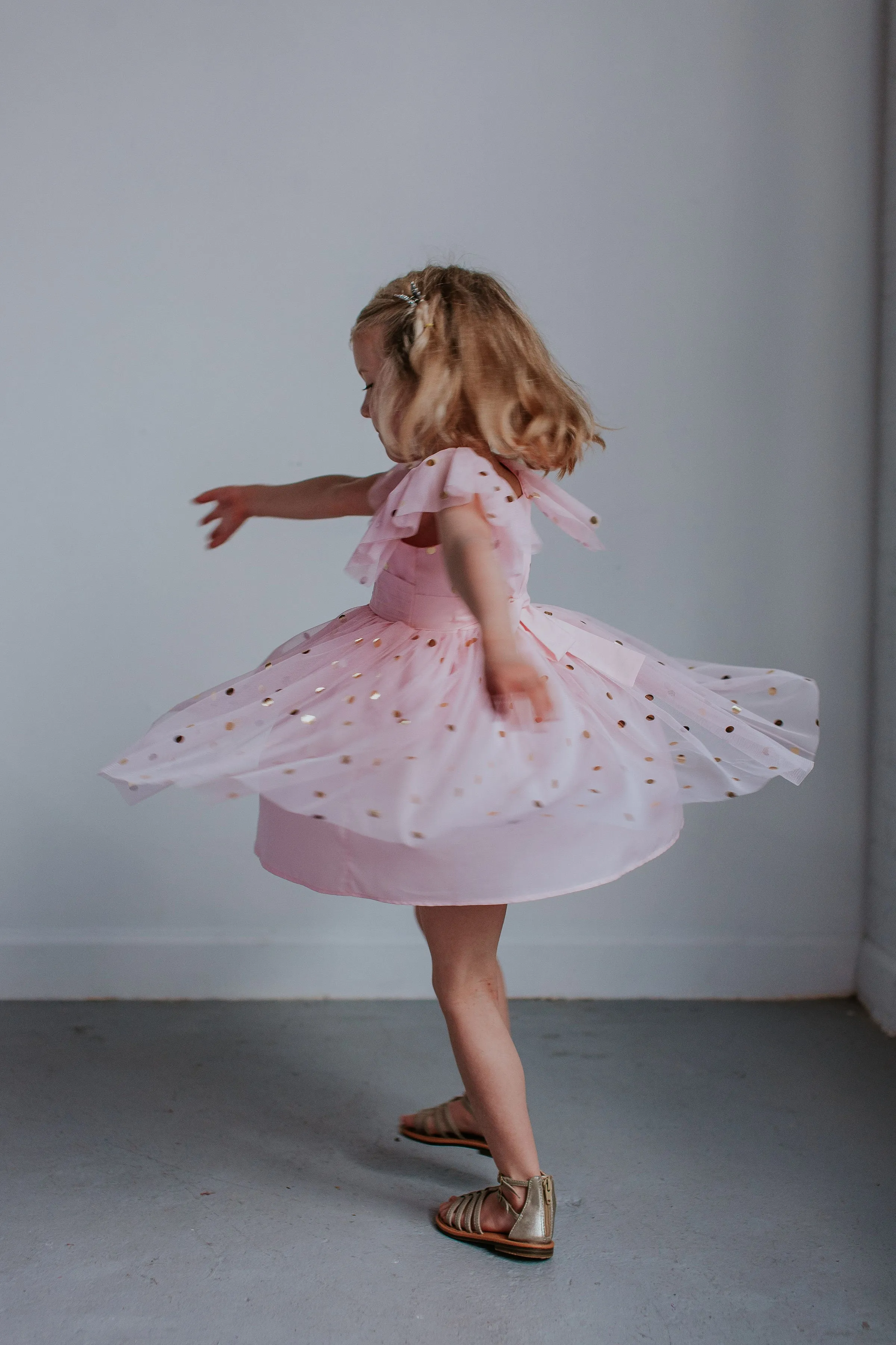 Little Girl's Pink Tulle Dress with Gold Polka Dots